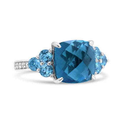 18K White Gold 10mm Cushion Shaped Blue Topaz and 1/6 Cttw Diamond 3 Stone Style Ring (F-G Color, VS1-VS2 Clarity)